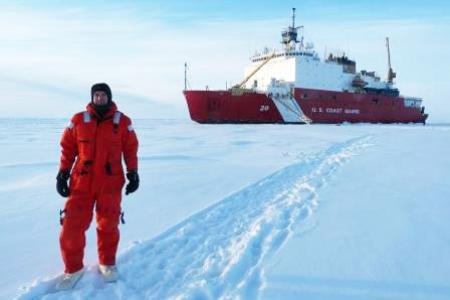 Chris Marsay at the North Pole in front of the US Coast Guard Cutter Healy